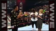 Mankind and The Rock with Rock's alleged elementary school teacher.